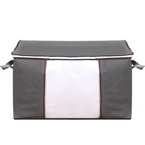 Large capacity gray quilted quilt storage bag with clear window and side handles for clothes.