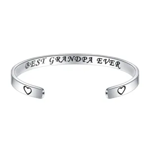 Stainless steel engraved open cuff bracelet detail view with heart pattern and grandpa quote.