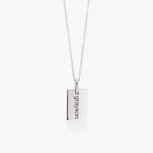 Minimalist silver rectangular tag necklace with custom text engraving, stylish fashion jewelry.