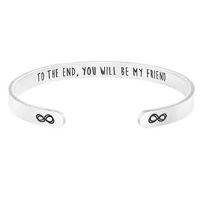 Stainless steel open cuff bracelet with engraved quote detail, simple and stylish everyday jewelry.