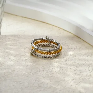 Bague empilée multicouche en acier inoxydable avec motif bambou, perles et torsadé.
