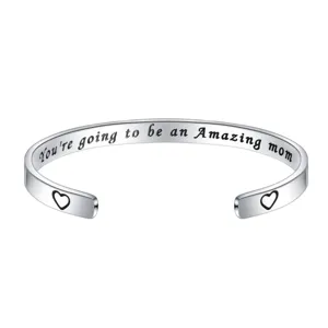 Stainless steel open cuff bracelet with engraved loving mom text and cute heart details for women.