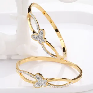 Stainless steel pavé diamond butterfly bangle bracelet with interlaced clasp design for women.