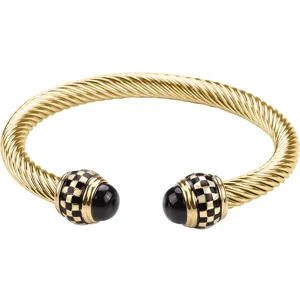 Gold twisted cable cuff bracelet with black checkered terminal caps for men fashion jewelry.