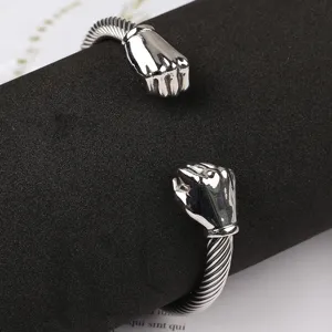Stainless steel fist cuff bracelet detail view, cable twisted bangle for men jewelry.