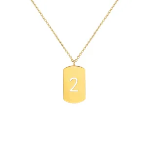 Close-up detail of the gold-plated dog tag necklace featuring number 2 pendant craftsmanship.