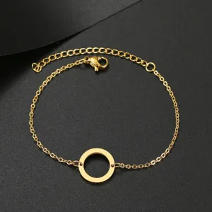 Dainty gold circle bracelet with minimalist open ring pendant and adjustable chain detail.