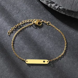Exquisite gold-plated heart cut-out bar bracelet detail view with adjustable extension chain.