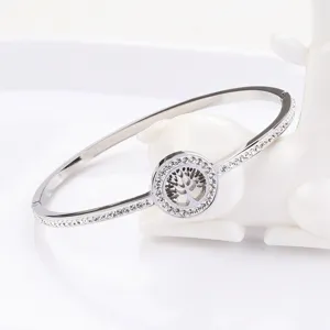 Close-up detail of the stainless steel rhinestone tree of life bracelet, fine sparkle and craft.