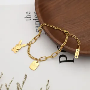 Gold stainless steel chain bracelet featuring cute bunny charm and metal tag detail.