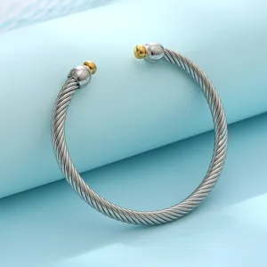 Bracelet jonc ouvert en acier inoxydable torsade avec embouts boules dores pour femmes mode