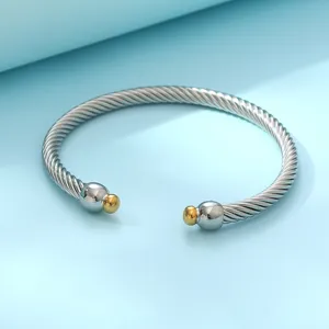 Bracelet jonc torsadé en acier inoxydable avec embouts sphériques dorés pour femmes mode.