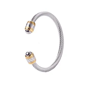 Bracelet manchette jonc cable torsade bicolore en acier inoxydable pour homme chic.