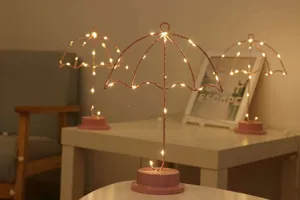 Lampara de mesa LED de hierro forma de paraguas rosa minimalista luz de noche