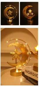 Close-up details of the golden iron art moon star LED decorative lamp glowing softly in warm light.