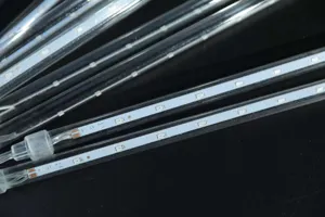 Detailed view of LED meteor shower light tubes, bright LED chips inside clear waterproof tubes.