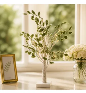 Lampara de arbol de abedul LED con hojas verdes y luces calidas para decoracion interior.
