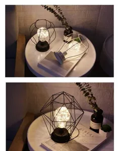 Detailopname van de minimalistische ijzeren kunst geometrische LED tafellamp met licht.