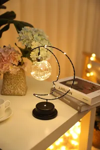 Charming moon shape LED decorative night light with fairy lights, warm bedroom ambiance lamp.