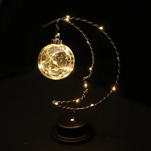 LED moon shape table lamp with hanging glass ball fairy lights for cozy room decor.