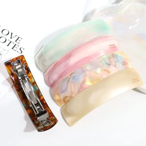 Set di eleganti mollette per capelli in acetato colorato per eleganti code di cavallo chic.