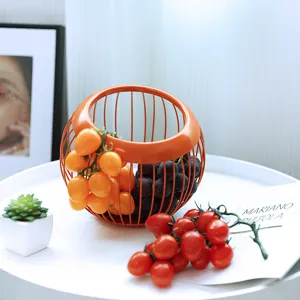Moderno cestino di frutta in filo di ferro arancione per soggiorno tavolino ciotola di frutta