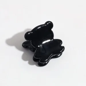 Black cute mini bear hair claw clip detail shot, sweet style small hair accessory for bangs.