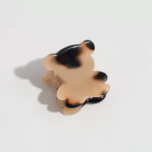 Mini tortoiseshell bear hair claw clip detail shot, perfect for side hair and bangs styling.
