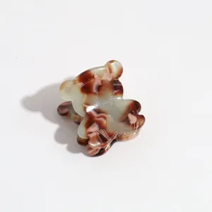 Cute mini bear hair claw clip detail, tortoise shell resin pattern for side bangs and hair.
