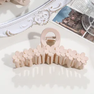 Large frosted frangipani hair claw clip with cute daisy flower design for women hair styling.