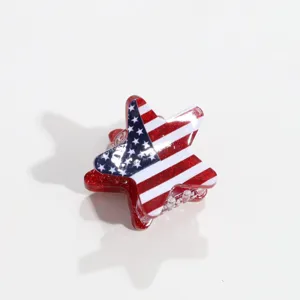 Pince a cheveux en forme d'etoile avec drapeau americain et details pailletes brillants.