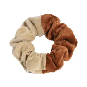 Detailed close-up of a two-tone velvet hair scrunchie, soft texture, perfect for daily styling.