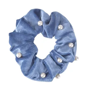 Blue velvet hair scrunchie detail view, elegant pearl decoration for everyday styling.