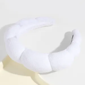 White sponge headband detail shot showing the soft padded cloud texture for daily washing and styling.