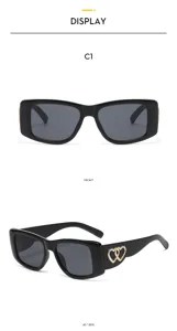 Vintage black cat-eye sunglasses with metal heart decor for women chic UV protection