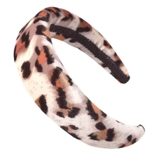 Close-up detail of the stylish leopard print velvet padded headband, showing soft texture.