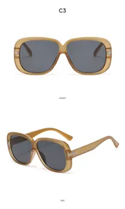 Occhiali da sole quadrati oversize con elegante montatura spessa e lenti scure all'aperto.