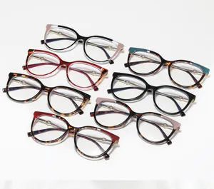 Detail view of retro large-frame cat-eye sunglasses with heart decor and various colors.