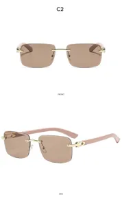 Lunettes de soleil carrées sans monture avec verres bruns, charnières dorées et branches roses.