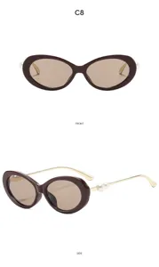 Detailed view of women retro oval sunglasses with elegant pearl decoration and gold temples.