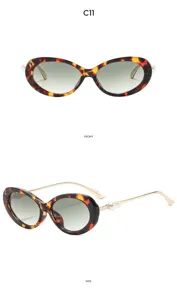 Detail view of vintage oval tortoiseshell sunglasses with elegant pearl temple decor.