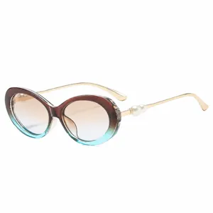 Fashion vintage oval sunglasses for women with gradient lenses and elegant pearl metal temples.