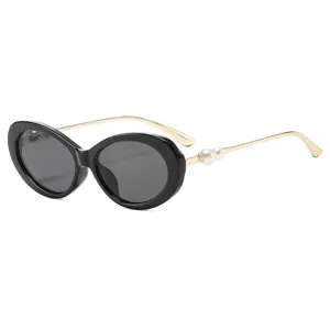 Fashion vintage oval sunglasses for women, chic black frame with gold temples and pearl decor.