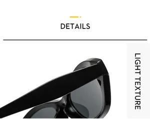 Gros plan de lunettes de soleil œil-de-chat noires, texture brillante et monture élégante.