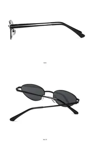 Detailed view of vintage retro black metal oval sunglasses, trendy minimalist design.