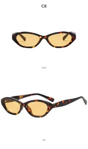Vue détaillée de lunettes de soleil tendance œil-de-chat écaille avec des verres ambrés.