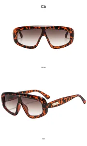 Grosse Sonnenbrille mit Leo-Muster, Farbverlaufsgläsern und elegantem Metalldetail am Bügel.