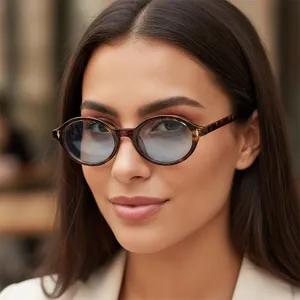Retro oval tortoise shell sunglasses for women, fashion metal rivet anti UV eyewear.