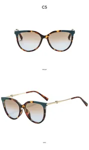 Oversized cat-eye vintage sunglasses with tortoiseshell frame and heart metal temples.