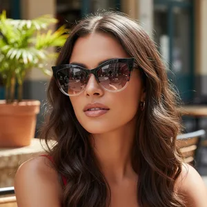 Women's fashion cat-eye sunglasses with gradient lenses and chic black frame for outdoor wear.
